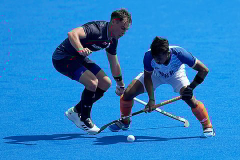 Vivek Sagar Prasad and Thomas Habif battle for the ball